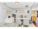 Bright dining room with elegant table setting, wine racks, and view into the yard at 4539 Wild Rose Ct, Orlando, FL 32808