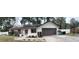 House exterior with solar panels, garage, and landscaping at 4539 Wild Rose Ct, Orlando, FL 32808