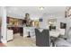 Modern kitchen and dining area featuring stainless steel appliances, granite countertops, and stylish furnishings at 4539 Wild Rose Ct, Orlando, FL 32808