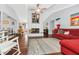 Large living room with a fireplace, vaulted ceiling, dark floors, and neutral color scheme at 4539 Wild Rose Ct, Orlando, FL 32808