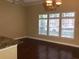 Bright and spacious living room with hardwood floors and large windows at 705 Celebration Ave # 705, Celebration, FL 34747