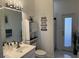 Modern bathroom with a walk-in shower and gray vanity at 1150 Sweet Heather Ln, Apopka, FL 32712