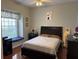 Guest bedroom with window seat and hardwood floors at 1150 Sweet Heather Ln, Apopka, FL 32712