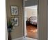 View of bedroom from hallway, showcasing hardwood floors at 1150 Sweet Heather Ln, Apopka, FL 32712