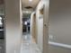 Bright hallway with marble floors and view into living room at 1150 Sweet Heather Ln, Apopka, FL 32712