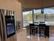 Kitchen nook with pool view, breakfast table for four, and smart refrigerator at 1150 Sweet Heather Ln, Apopka, FL 32712