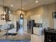 Modern kitchen with white cabinets and granite countertops at 1150 Sweet Heather Ln, Apopka, FL 32712