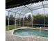 Inviting pool area with covered patio and lush landscaping at 1150 Sweet Heather Ln, Apopka, FL 32712