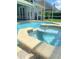 Relaxing pool area with a spa and patio at 1150 Sweet Heather Ln, Apopka, FL 32712