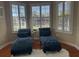 Relaxing sitting area with two chaise lounges and abundant natural light at 1150 Sweet Heather Ln, Apopka, FL 32712