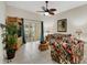 Inviting living room featuring tiled floors, large sliding glass doors to the patio, and comfortable seating at 301 New Providence Promenade, Davenport, FL 33897