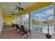 A community building porch with rocking chairs overlooking the pool area at 301 New Providence Promenade, Davenport, FL 33897