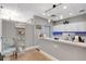 A modern reception area with a counter, decorative lighting, and tile flooring at 301 New Providence Promenade, Davenport, FL 33897