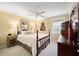 Sunlit bedroom featuring carpet flooring, ceiling fan, and two dressers at 4503 Se 14Th St, Ocala, FL 34471