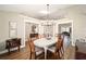 Bright dining room featuring hardwood floors, a decorative light fixture and lots of natural light at 4503 Se 14Th St, Ocala, FL 34471