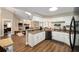 Spacious kitchen featuring granite countertops, white cabinets, stainless steel appliances, and an open layout at 4503 Se 14Th St, Ocala, FL 34471