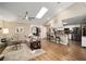 Open-concept living room with vaulted ceiling, skylight, and view to the kitchen area at 4503 Se 14Th St, Ocala, FL 34471