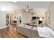 Bright living room featuring hardwood floors, a white brick fireplace, and built-in bookshelves at 4503 Se 14Th St, Ocala, FL 34471