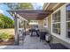 Outdoor kitchen with a covered grill, sink, and ample counter space, ideal for barbecues and gatherings at 4503 Se 14Th St, Ocala, FL 34471