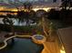 Night aerial view of backyard pool, lake, and neighborhood homes at 889 Brantley Dr, Longwood, FL 32779