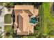 Aerial view of the property showcasing the house, pool, patio, and landscaped yard at 889 Brantley Dr, Longwood, FL 32779