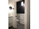 Powder room with a stylish white and dark gray color scheme at 889 Brantley Dr, Longwood, FL 32779