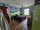 Bedroom with hardwood floors, a bed, and fun wall decor at 889 Brantley Dr, Longwood, FL 32779