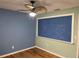 Bedroom with a chalkboard wall and ceiling fan at 889 Brantley Dr, Longwood, FL 32779