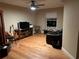 Cozy den featuring hardwood floors and comfortable seating at 889 Brantley Dr, Longwood, FL 32779