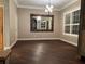 Elegant dining room with hardwood floors and large mirror at 889 Brantley Dr, Longwood, FL 32779