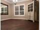 Formal dining room featuring hardwood floors and antique cabinet at 889 Brantley Dr, Longwood, FL 32779