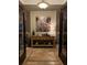 Elegant entryway with tiled floors and console table at 889 Brantley Dr, Longwood, FL 32779