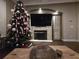 Living room with fireplace and Christmas tree at 889 Brantley Dr, Longwood, FL 32779