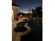 Night view of illuminated pool; string lights, plants at 889 Brantley Dr, Longwood, FL 32779