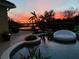 Beautiful pool with seating, plants, and a sunset view of the water feature in the background at 889 Brantley Dr, Longwood, FL 32779