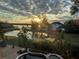 Stunning sunset view over the lake from backyard at 889 Brantley Dr, Longwood, FL 32779