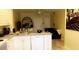 Kitchen with island, white cabinetry, and modern appliances at 860 N Orange Ave # 258, Orlando, FL 32801