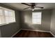 Bedroom with hardwood floors and ceiling fan at 11331 Northern Ave, Leesburg, FL 34788