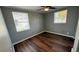 Bright bedroom with hardwood floors and ceiling fan at 11331 Northern Ave, Leesburg, FL 34788