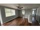 Living room with hardwood floors and built-in shelving at 11331 Northern Ave, Leesburg, FL 34788