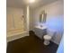 Clean bathroom with shower/tub combo and gray vanity at 373 E Waldo St, Groveland, FL 34736