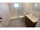 Updated bathroom with stylish tile floor and modern vanity at 373 E Waldo St, Groveland, FL 34736