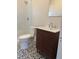 Modern bathroom with patterned floor tile and a walk-in shower at 373 E Waldo St, Groveland, FL 34736