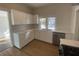 Modern kitchen with white cabinets and stainless steel appliances at 373 E Waldo St, Groveland, FL 34736