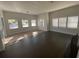 Bright living room with hardwood floors and large windows at 373 E Waldo St, Groveland, FL 34736