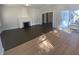 Open living room with hardwood floors and fireplace at 373 E Waldo St, Groveland, FL 34736