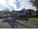 One-story house with a two-car garage and well-manicured lawn at 13026 Se 97Th Terrace Rd, Summerfield, FL 34491