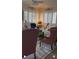 Spacious living room with comfortable seating and large windows at 13026 Se 97Th Terrace Rd, Summerfield, FL 34491