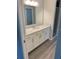 White vanity with quartz countertop and brushed nickel hardware at 6435 Sw 204 Ave, Dunnellon, FL 34431