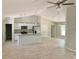 Open kitchen with an island, stainless steel appliances, and white cabinets at 6435 Sw 204 Ave, Dunnellon, FL 34431